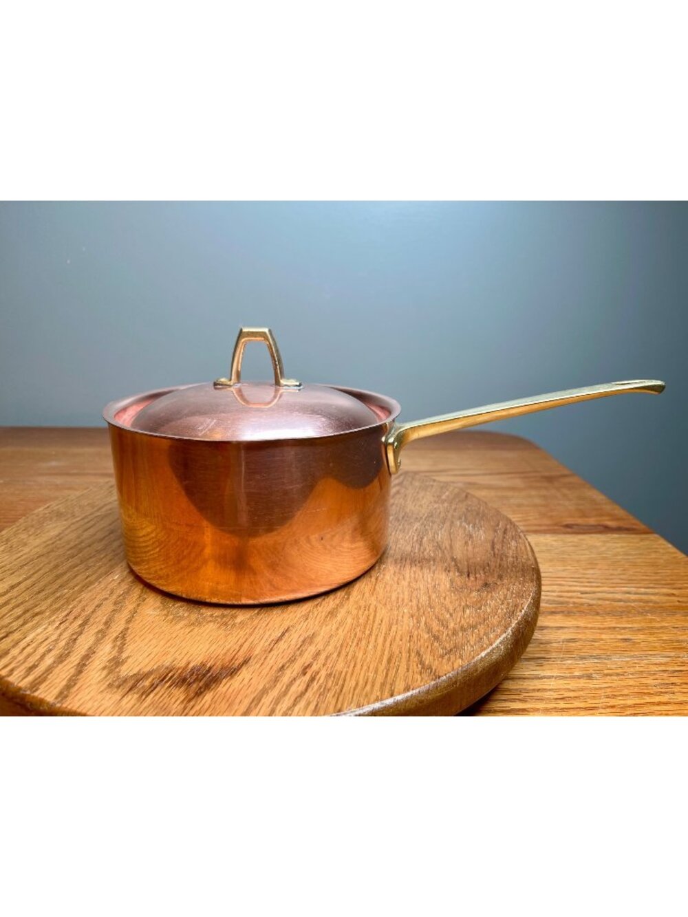 Paul Revere 1801  2 quart copper saucepan featuring a brass handle and matching